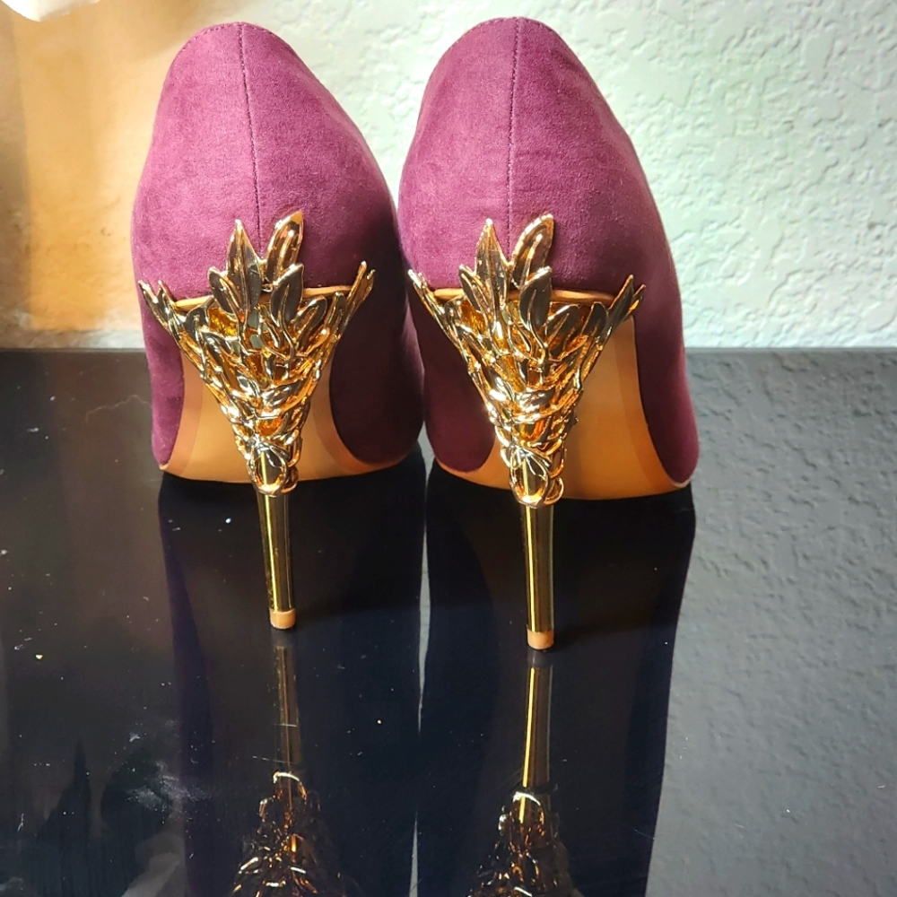Brand new never worn . Burgundy suede with gold design heels. Size 9 wide